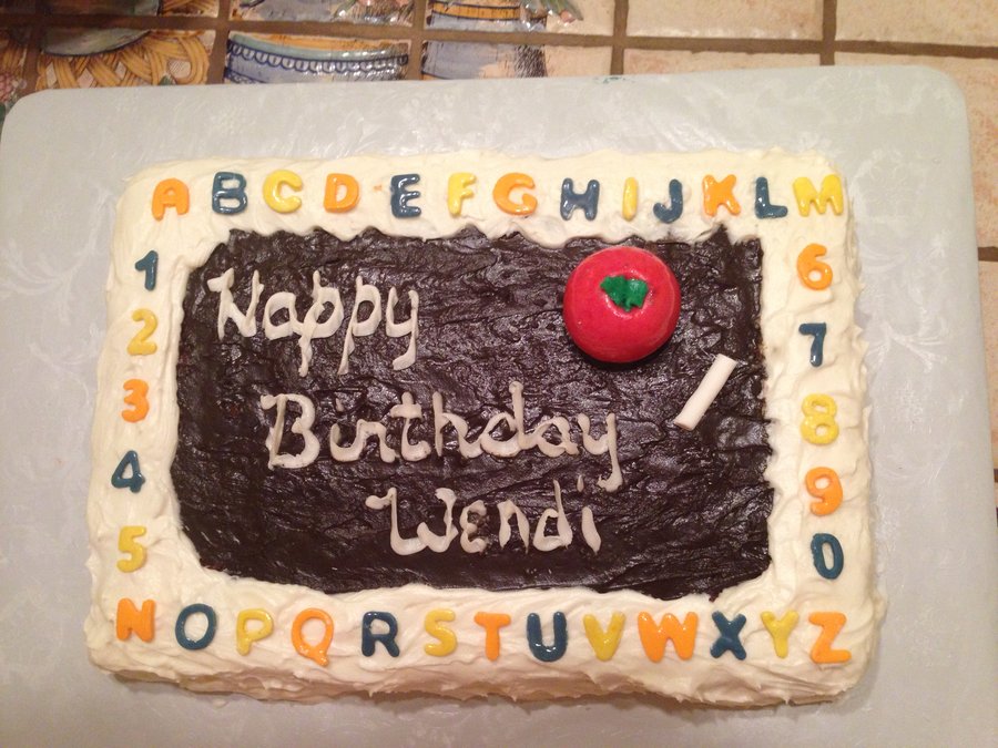 Chalkboard birthday sheet cake for a teacher, bordered with the alphabet and numbers, with an apple